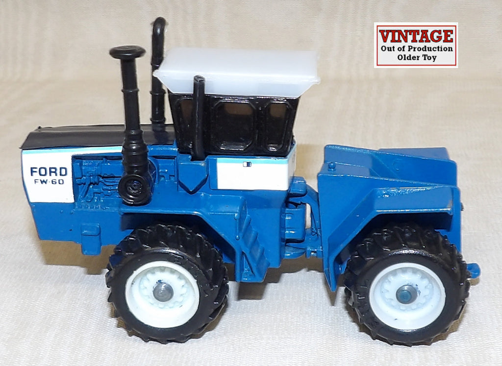 #1528 1/64 Ford FW-60 4WD Tractor with Single Wheels - No Box, AS IS